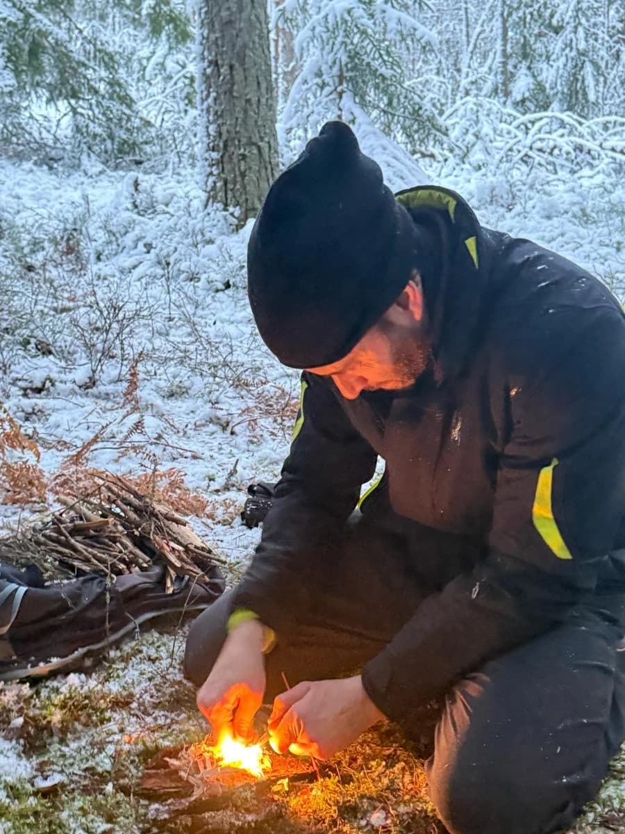 Building a fire at a wilderness retreat